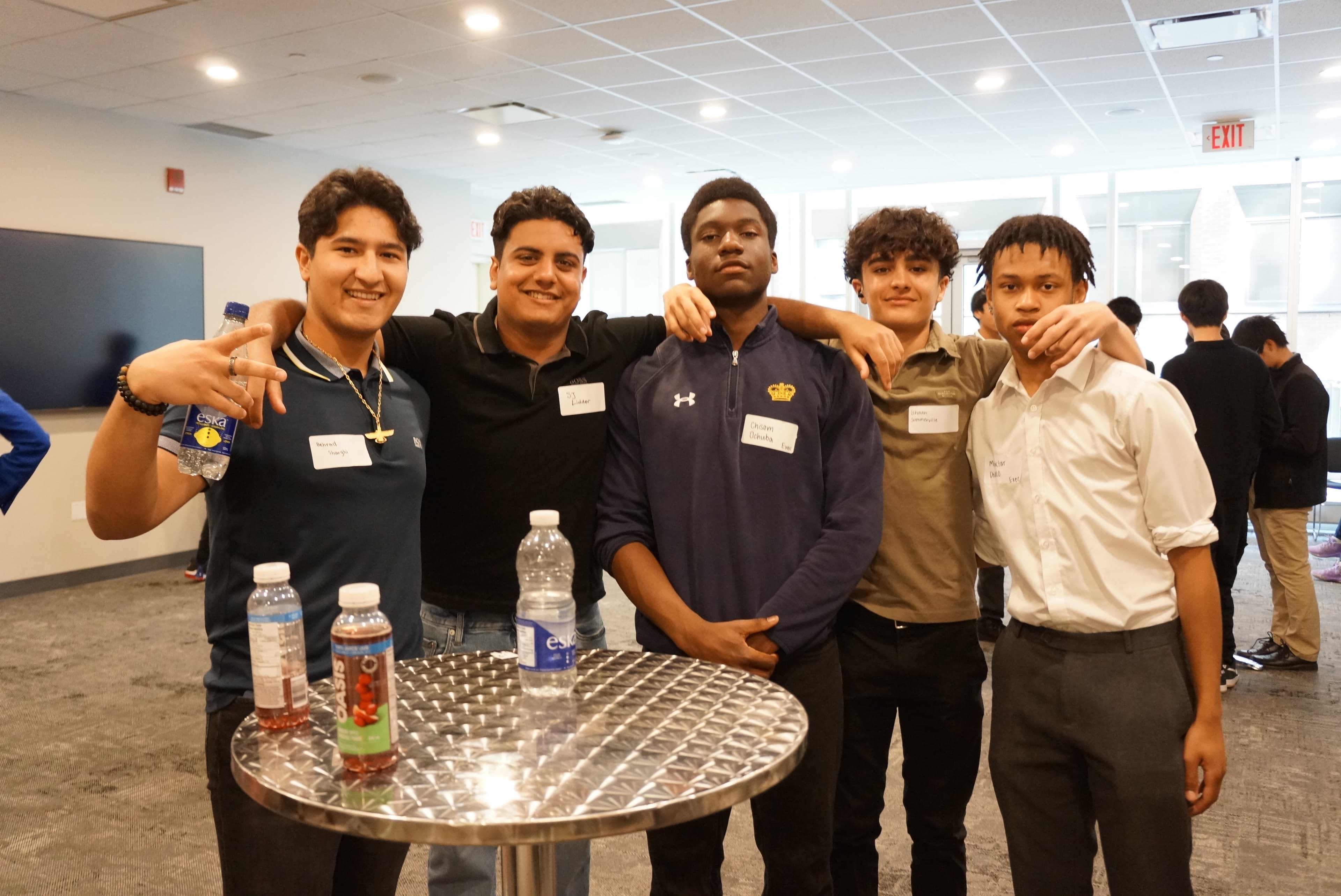 Students networking between sessions at TYSIC
