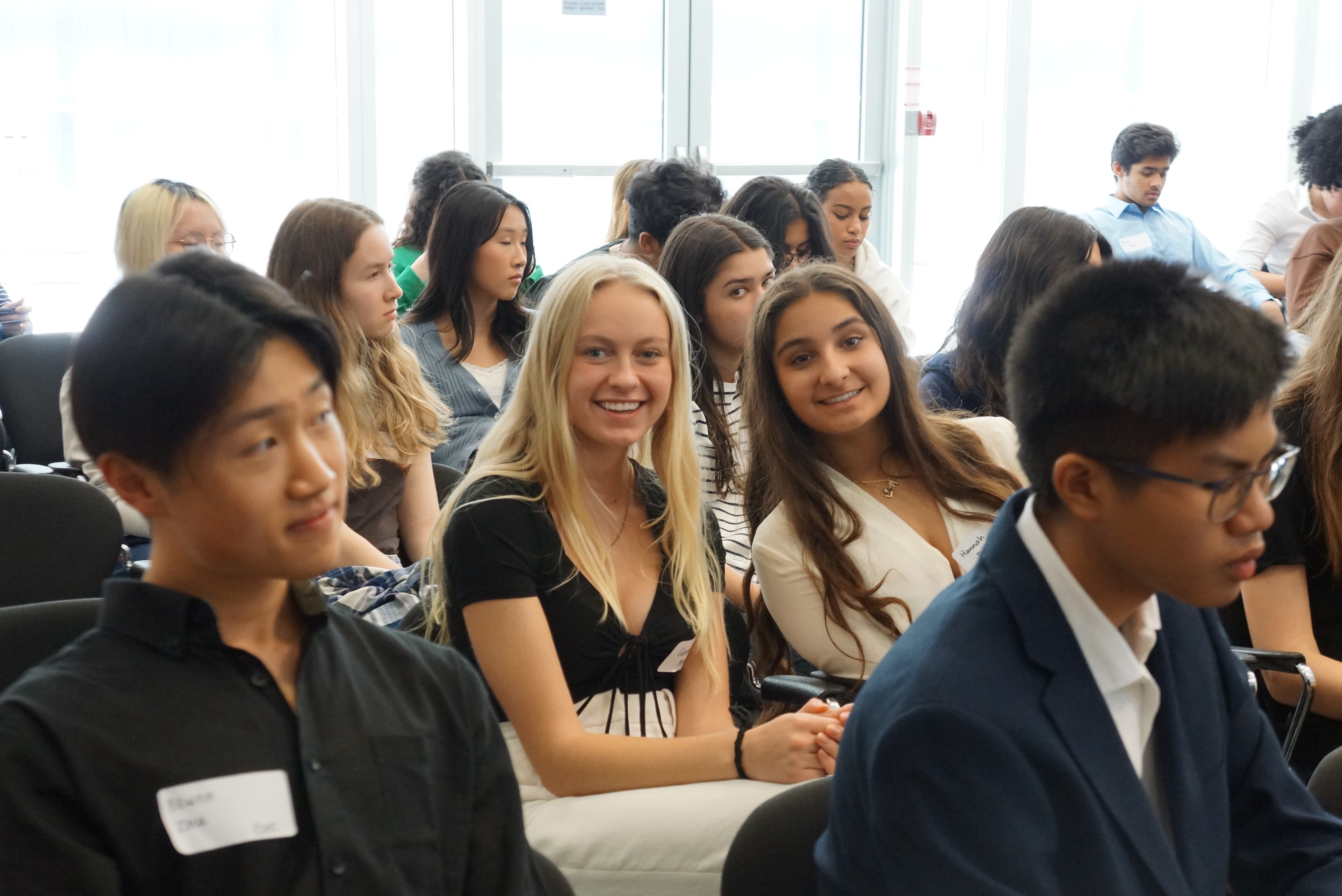 Students smiling at a past TYSIC conference