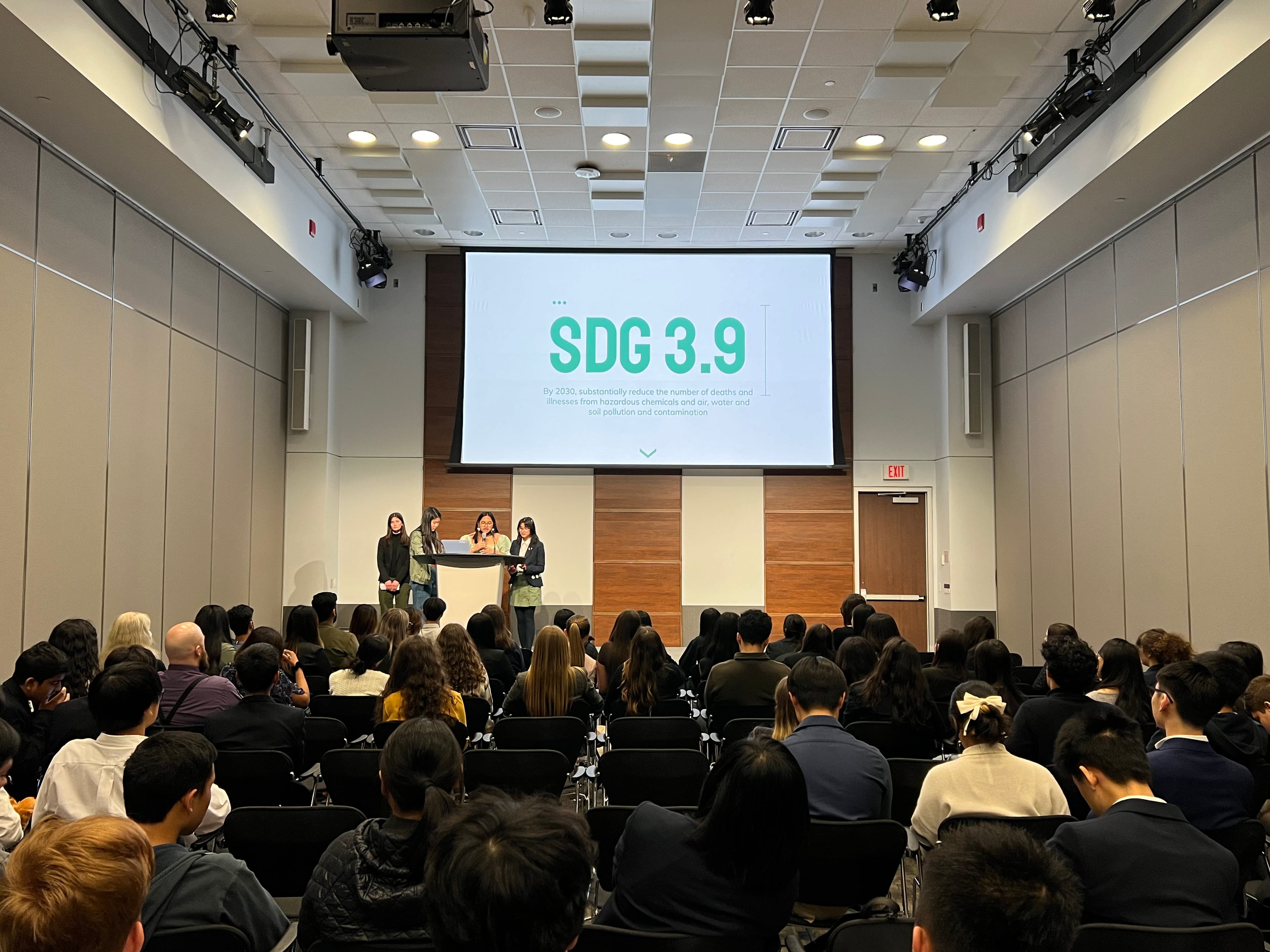 A student presentation on stage at TYSIC