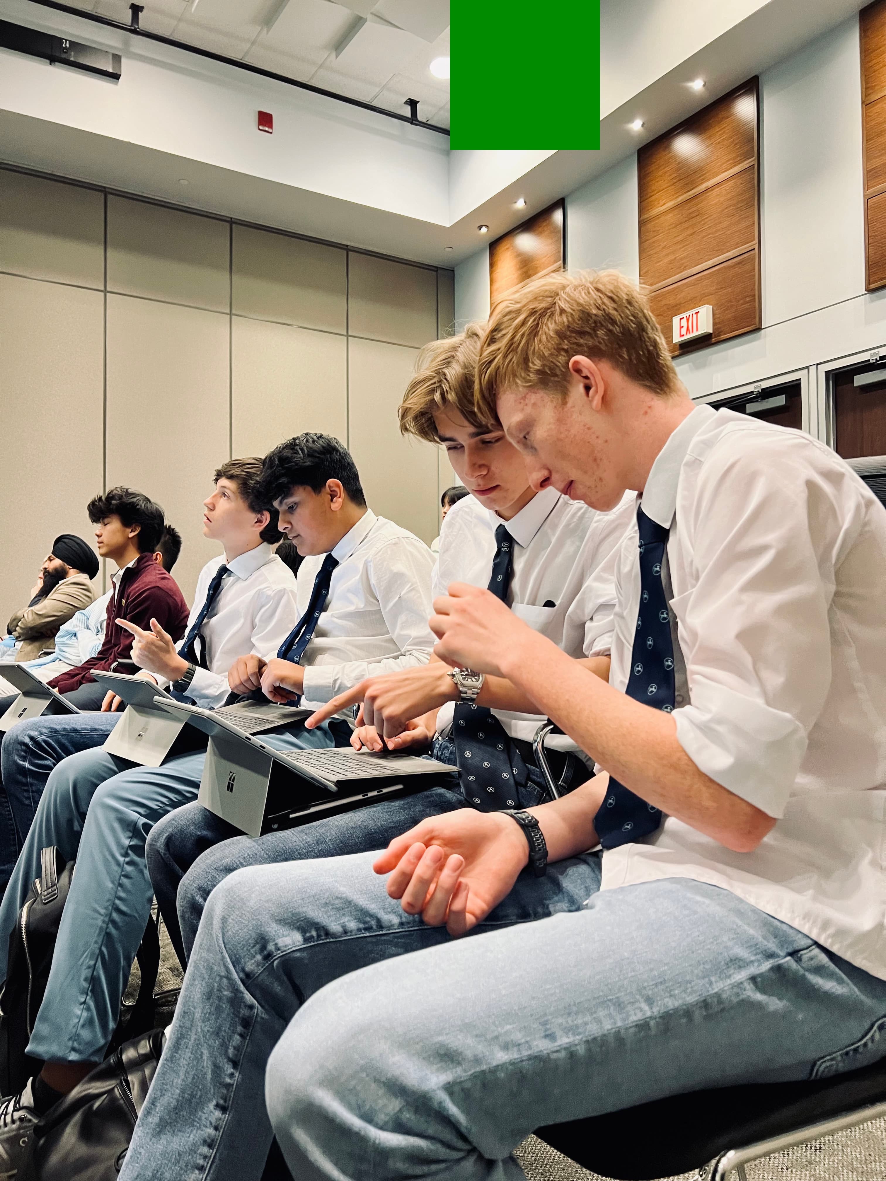 Students talking between sessions at TYSIC